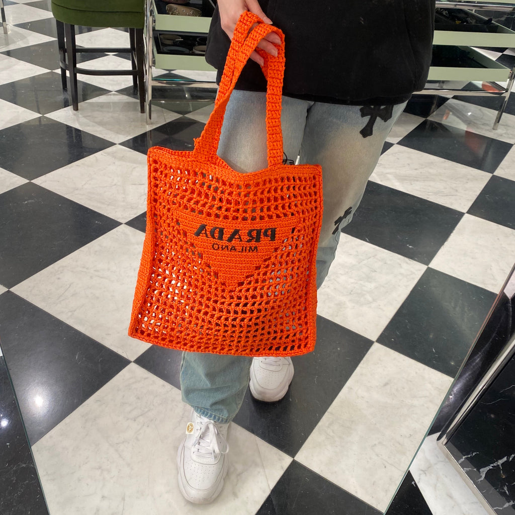 Prada orange raffia tote